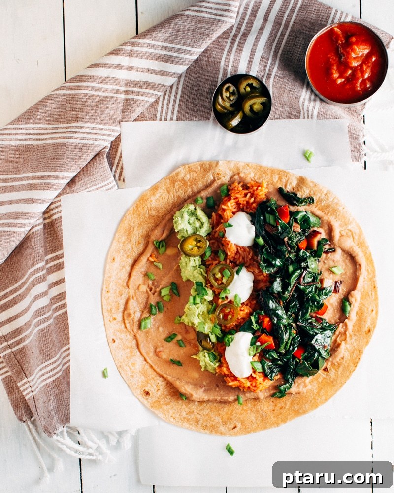 Vibrant Mexican Rice Bean and Greens Burritos 4 Ingredients laid out for assembling burritos, showcasing fresh avocado, salsa, and pickled jalapenos, ready for a flavorful meal.