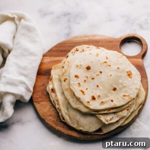 A stack of fresh flour tortillas.