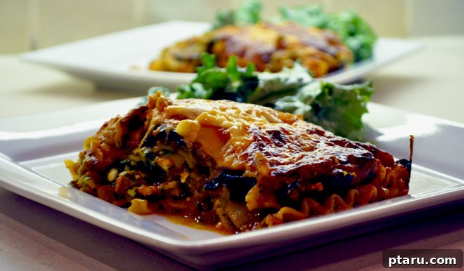 Savory Roasted Eggplant and Portobello Lasagna 4 Ingredients laid out for making Roasted Eggplant and Portobello Mushroom Lasagna, including fresh herbs, cheese, and roasted vegetables.