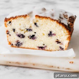 A blueberry pound cake sliced in half.