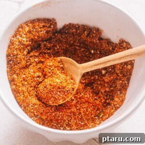 A close-up shot of a bowl filled with homemade taco seasoning.