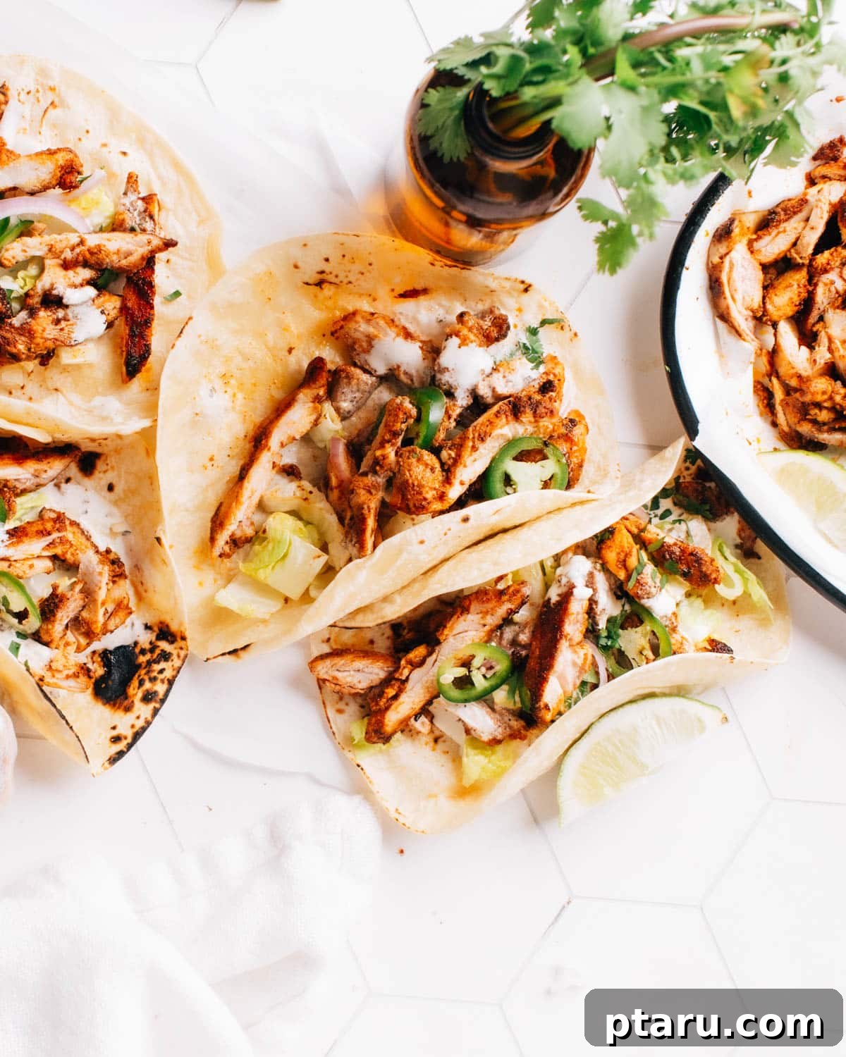 Cantina Style Chicken Tacos 2 Ready-to-eat chicken street tacos topped with a dollop of cilantro lime crema and garnished with sliced onions and jalapeno.