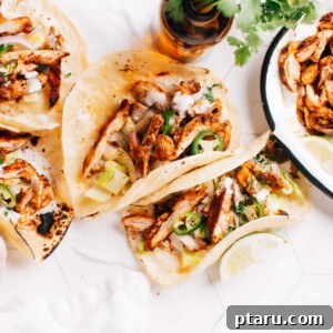 Chicken tacos on a table.