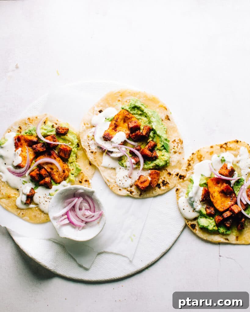 Sheet Pan Roasted Sweet Potato Halloumi Tacos 5 Close-up of a delicious Sheet Pan Halloumi and Sweet Potato Taco filled with roasted ingredients and fresh toppings.