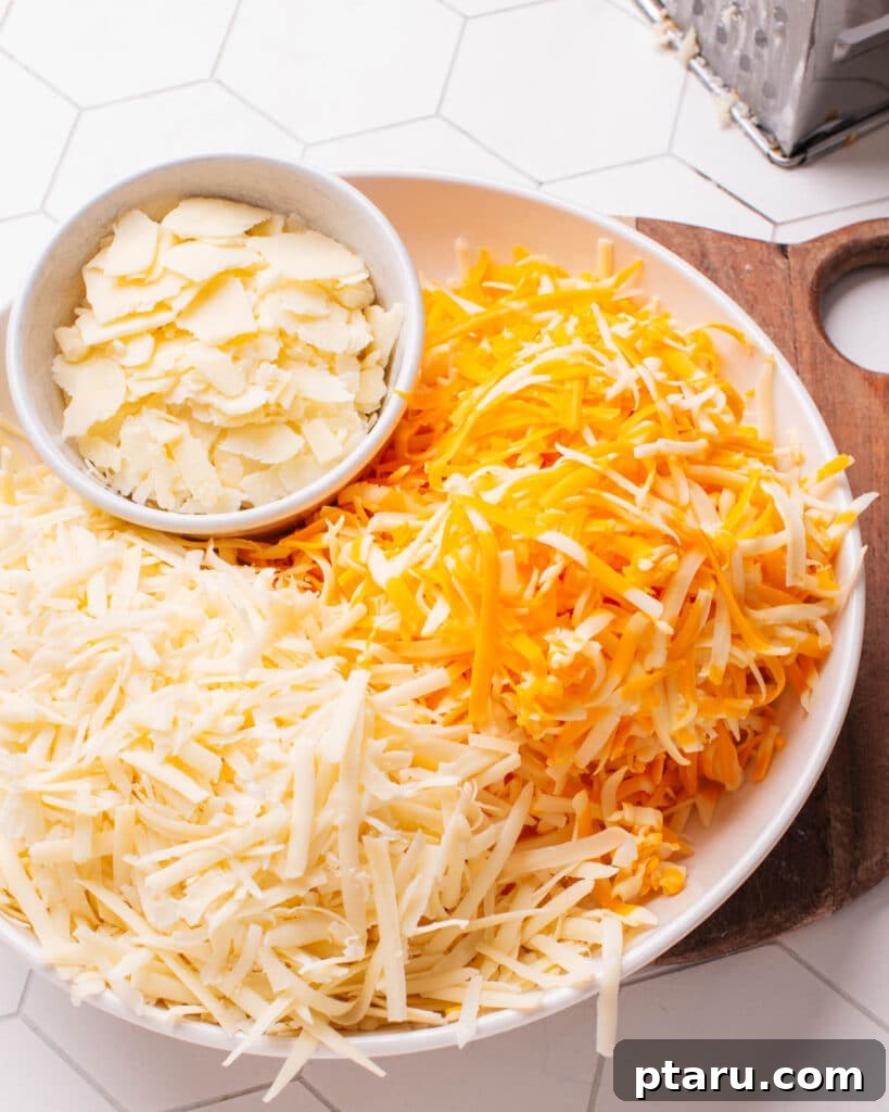 Golden Cheesy Foldover 3 A vibrant selection of different cheeses, suitable for quesadillas or macaroni and cheese, displayed on a wooden board.