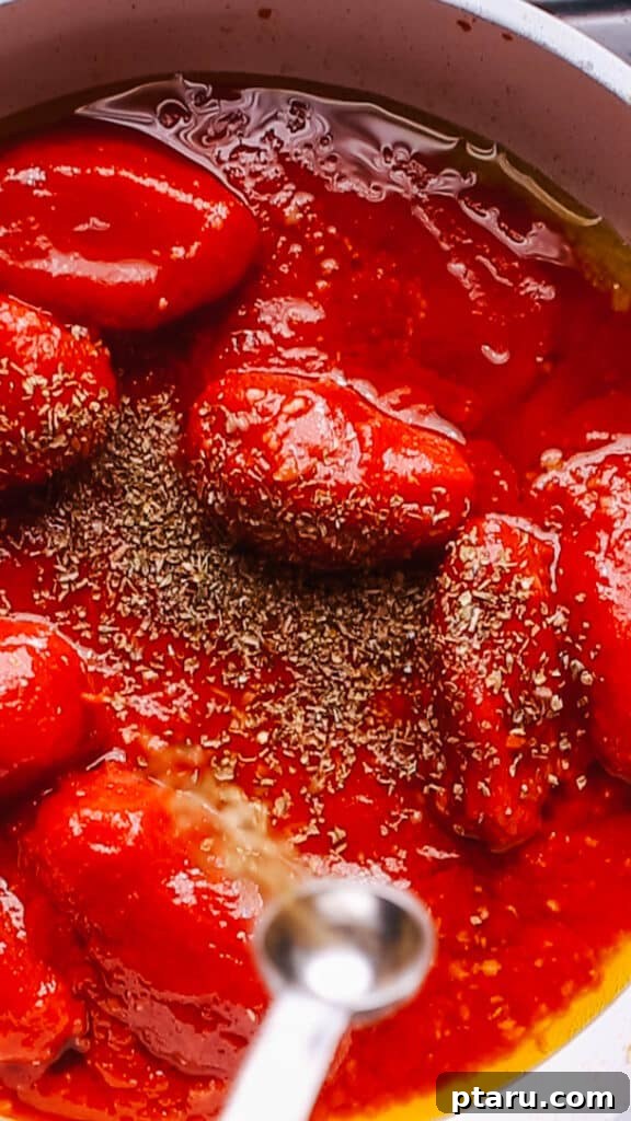 Homemade Pizza Sauce: The Only Recipe You'll Ever Need 10 Adding spices to pizza sauce.