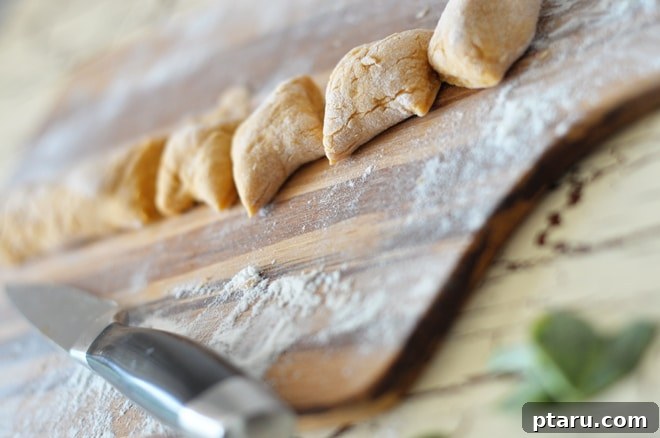 Harvest Gold Gnocchi 4 Fresh sage leaves sizzling in browned butter in a pan.