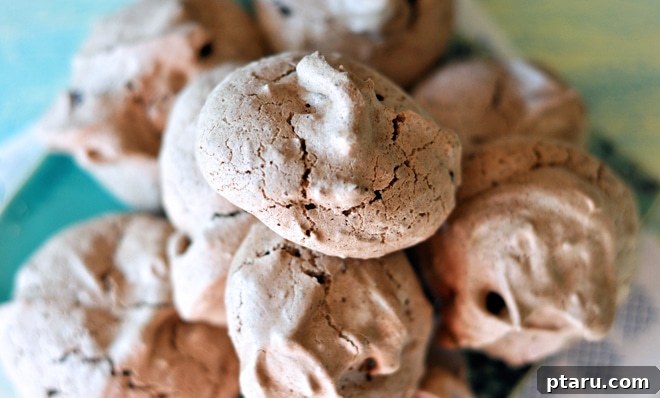 Dreamy Chocolate Almond Kisses 4 Ingredients laid out for baking chocolate almond meringues, including eggs, chocolate, and almonds.