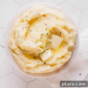 Mashed potatoes in a bowl with butter.