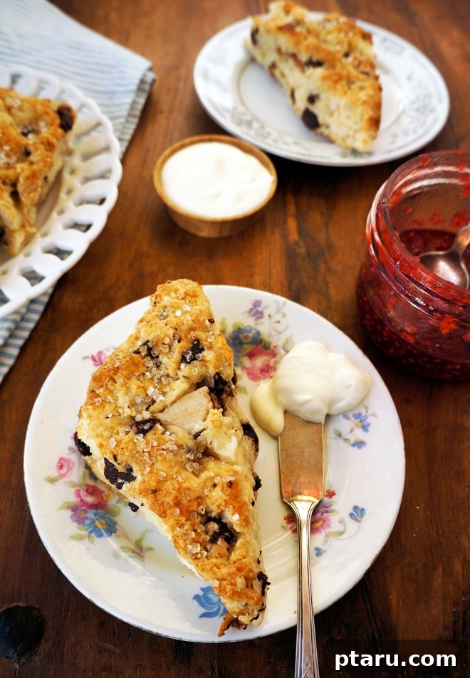 Decadent Dark Chocolate Ginger Pear Scones 3 Two Dark Chocolate Ginger Pear Scones served with a dollop of creme fraiche and a hot cup of tea.