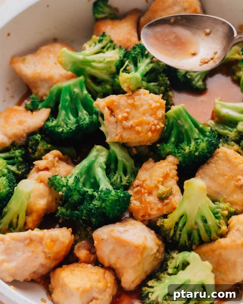 Garlic Herb Chicken and Broccoli Medley 7 The chicken and broccoli stir fry is cooked in a large skillet.