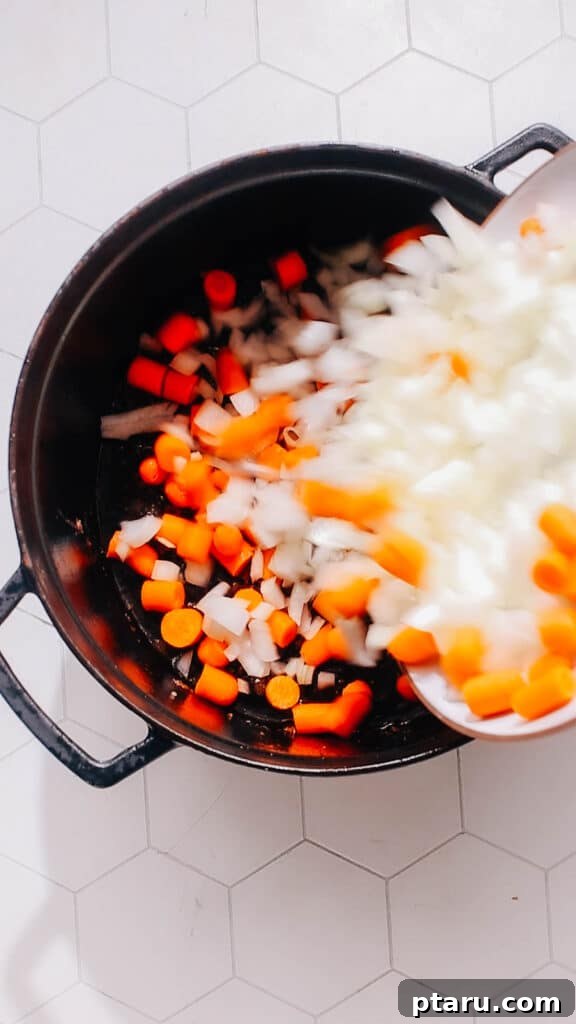 Homestyle Beef & Veggie Pie 5 Sautéing onions and carrots in the same pot after removing the beef.