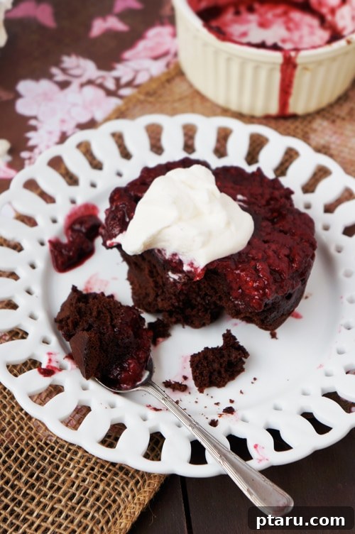 Rich Chocolate Raspberry Inverted Delights 7 A perfectly plated chocolate raspberry upside-down cake with whipped cream, ready to be enjoyed