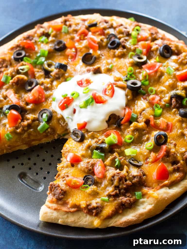 Over 35 Mouthwatering Leftover Taco Meat Recipes 15 Taco meat pizza topped with a dollop of sour cream and fresh veggies