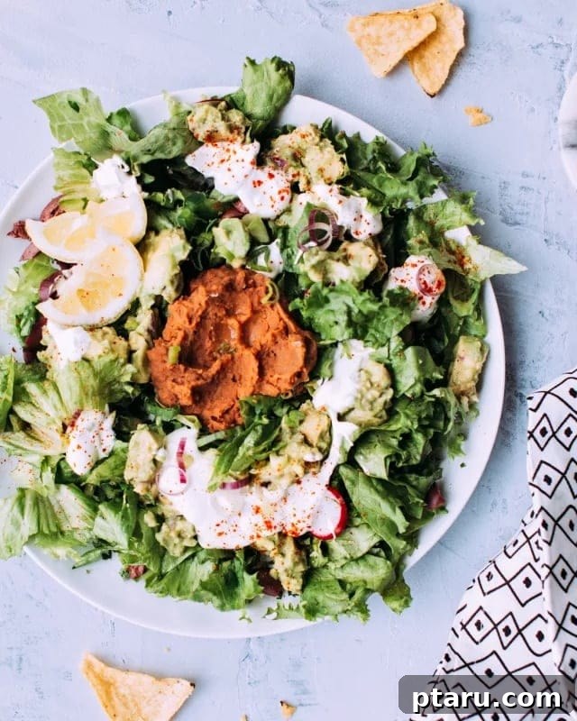 Over 35 Mouthwatering Leftover Taco Meat Recipes 4 Vegetarian taco salad in a white plate