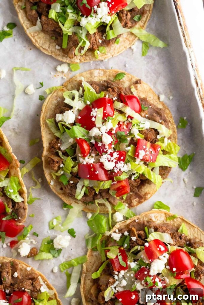 Over 35 Mouthwatering Leftover Taco Meat Recipes 7 Loaded taco meat tostadas on a baking sheet