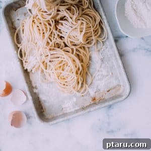 Fresh pasta on a baking sheet.