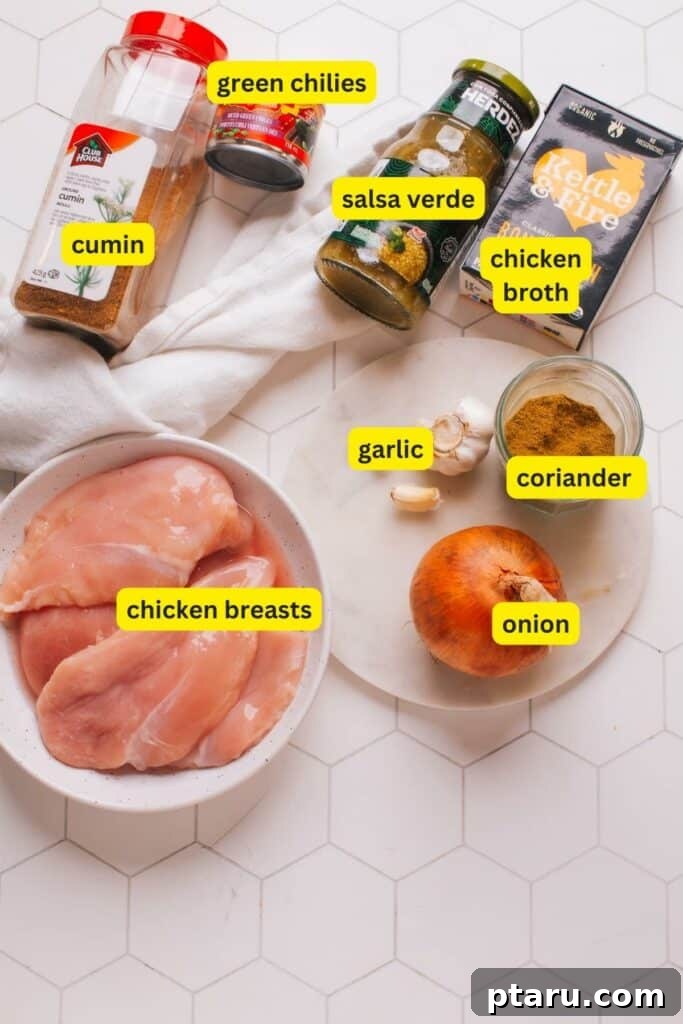 Effortless One-Pot Green Chicken Chili 3 A vibrant selection of fresh ingredients and pantry staples for green chicken chili arranged on a kitchen counter.