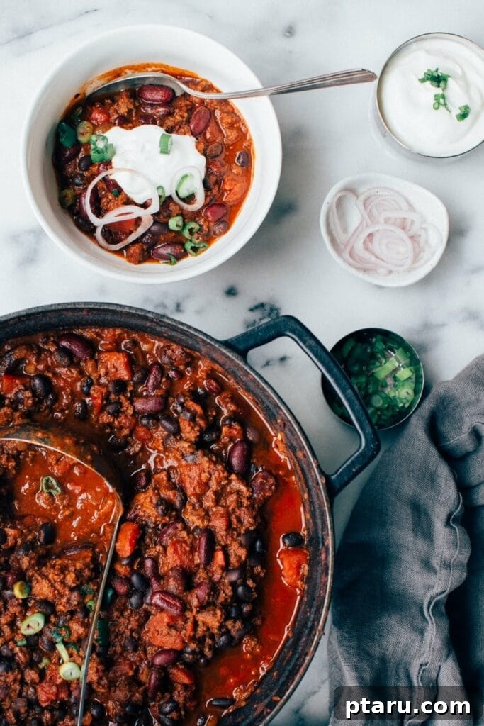 Homemade Chili Spice Blend 7 Ground beef chili in a pot with a bowl of chili next to it.