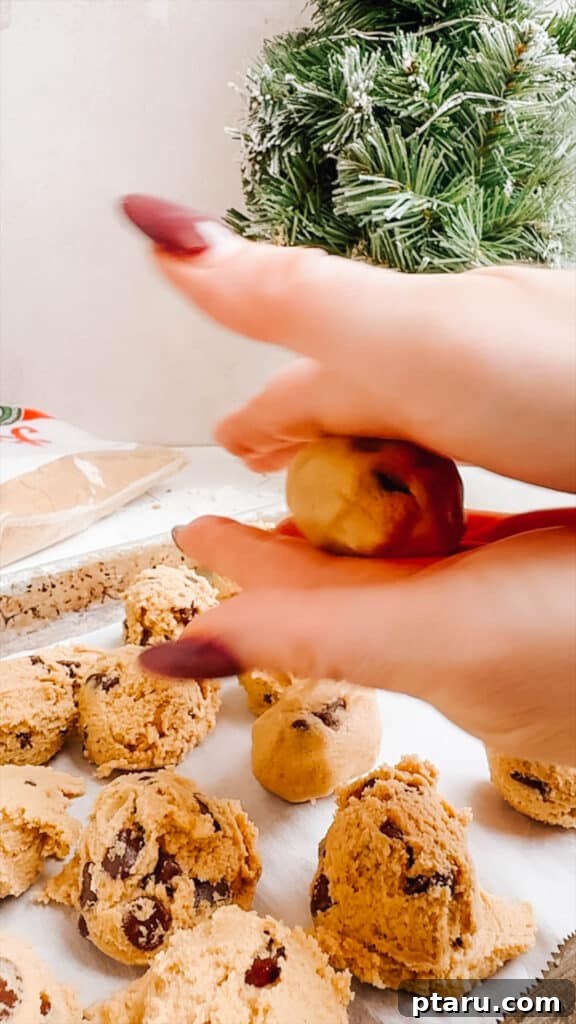 Effortless Cookie Dough Bliss 10 Hands meticulously rolling edible cookie dough into smooth, uniform balls, a key step before chilling and chocolate coating.