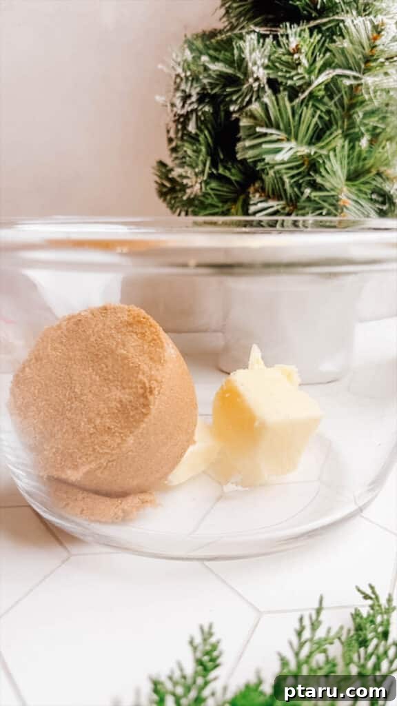 Effortless Cookie Dough Bliss 8 Softened butter and brown sugar creaming together in a mixing bowl, forming the rich, foundational base for edible cookie dough.