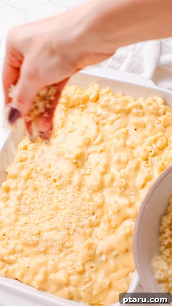 Mac and Cheese Perfection: The Ultimate Golden Sauce 11 Adding bread crumbs on baked macaroni and cheese.