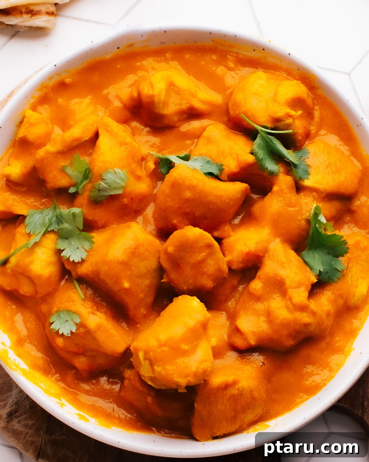Your New Favorite Quick Coconut Curry Chicken 2 Indian Coconut Curry Chicken in a bowl topped with cilantro, ready to be served.