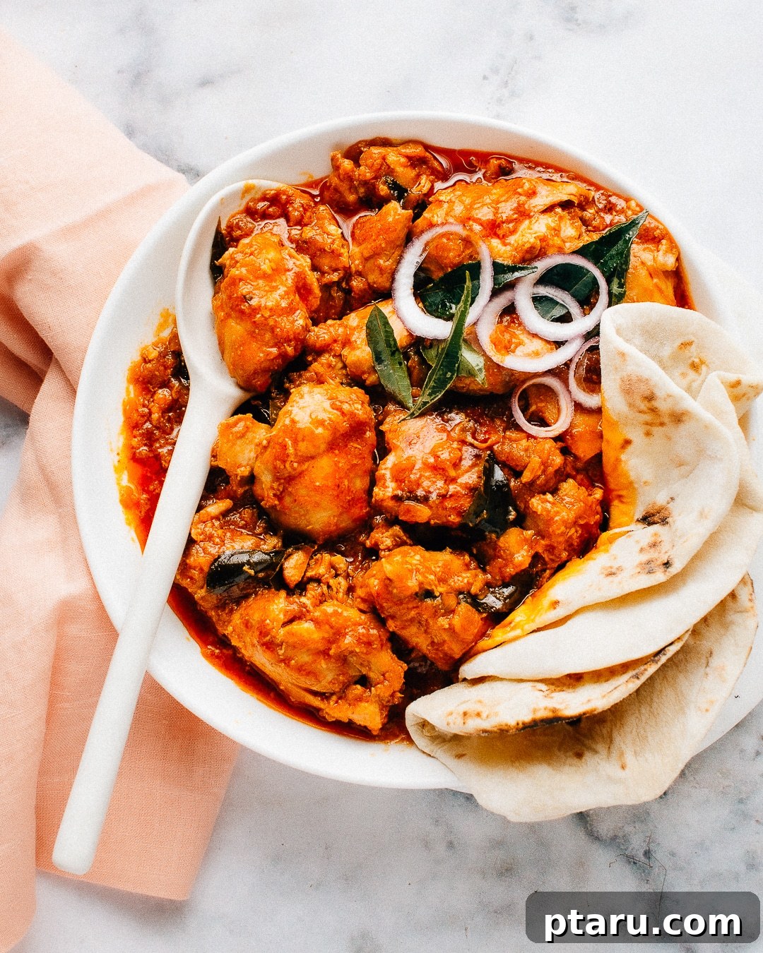 Chicken 65 India's Spicy Chicken Sensation 2 Chicken 65 Curry served in a huge white bowl with fluffy Indian flatbread