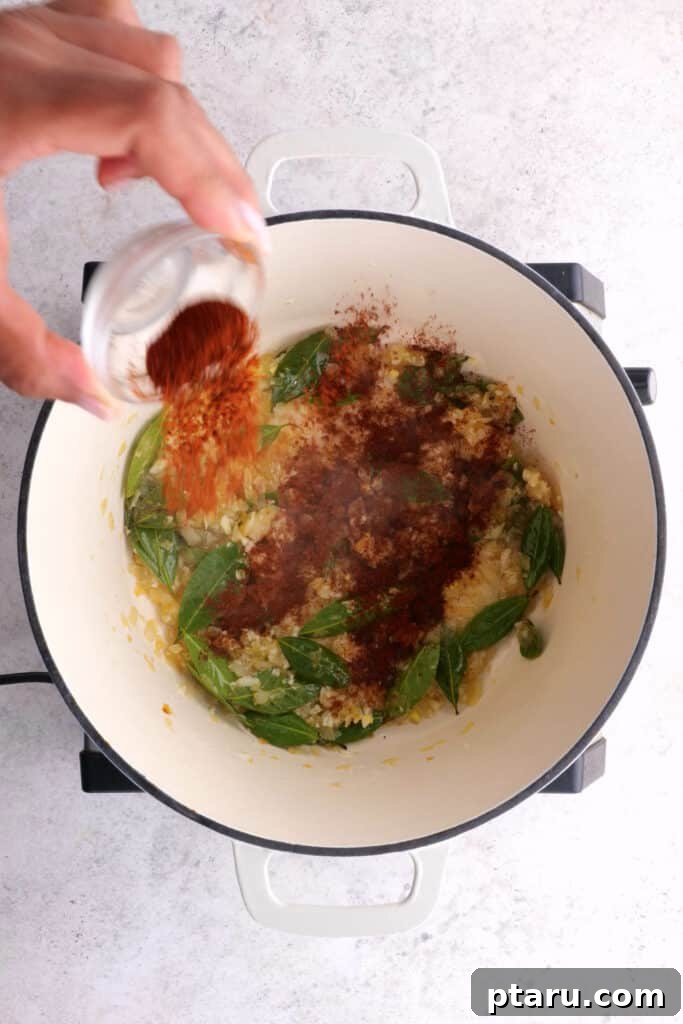 Chicken 65 India's Spicy Chicken Sensation 6 Adding cayenne powder to Chicken 65 mixture