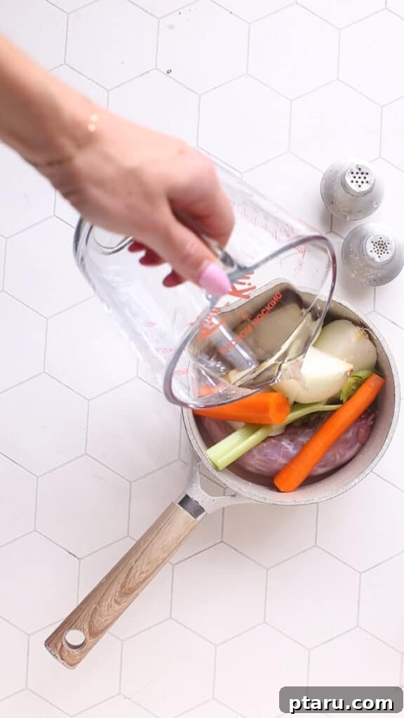 Easy Turkey Giblet Gravy No Drippings 4 A visual display of all the fresh ingredients needed for a homemade turkey Giblet Gravy, including giblets, vegetables, butter, and flour.