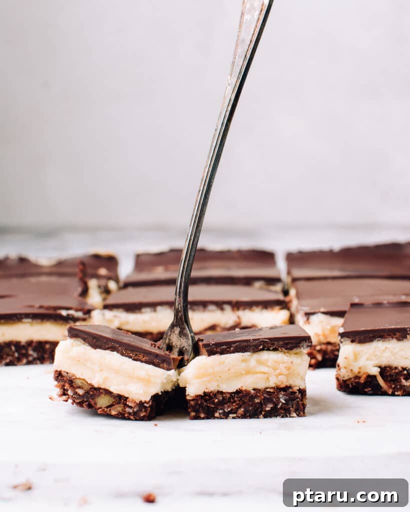 The Ultimate Nanaimo Bar Recipe 2 Decadent Classic Nanaimo Bars with perfect, distinct layers of cocoa, cream, and chocolate