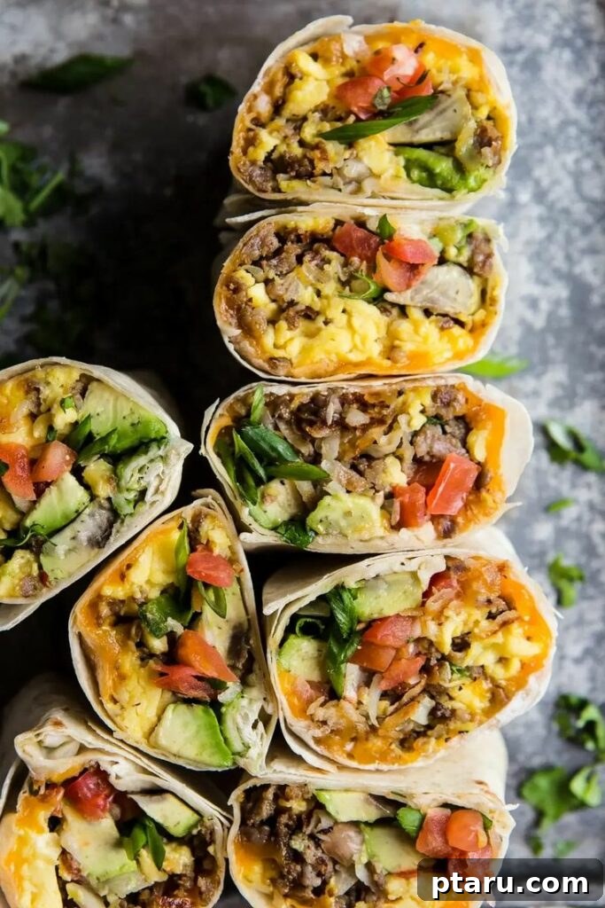 Rise and Shine: 23+ Sausage and Egg Breakfast Ideas 12 A vibrant Breakfast Burrito, generously stuffed with avocado, pork sausage, crispy potato, and other flavorful ingredients.