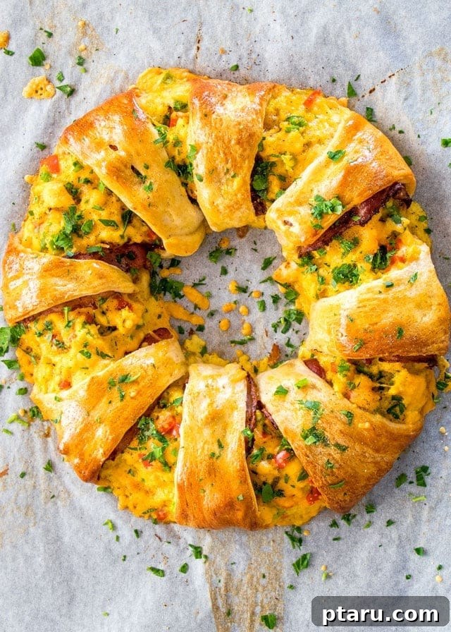 Rise and Shine: 23+ Sausage and Egg Breakfast Ideas 14 A beautifully arranged Crescent Breakfast Ring, golden and flaky, ready to be pulled apart and enjoyed.