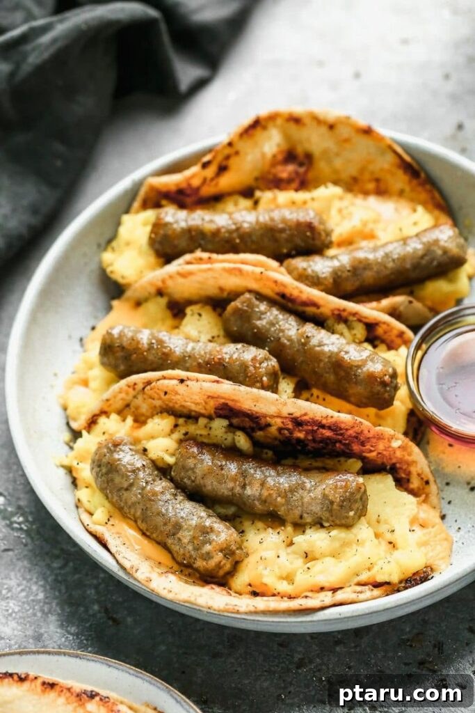 Rise and Shine: 23+ Sausage and Egg Breakfast Ideas 19 Innovative French Toast Sausage and Egg Tacos, combining sweet and savory elements in a playful presentation.