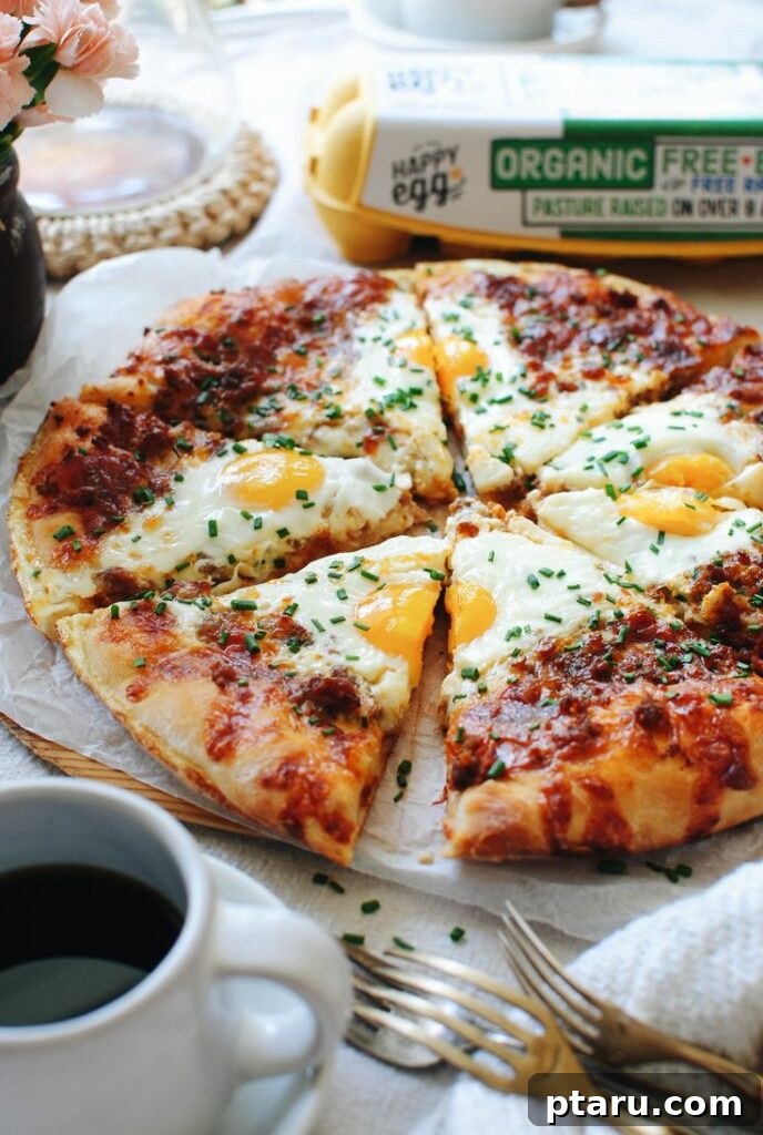 Rise and Shine: 23+ Sausage and Egg Breakfast Ideas 24 A tempting Breakfast Pizza topped with savory sausage, eggs, and cheese, baked to golden perfection.