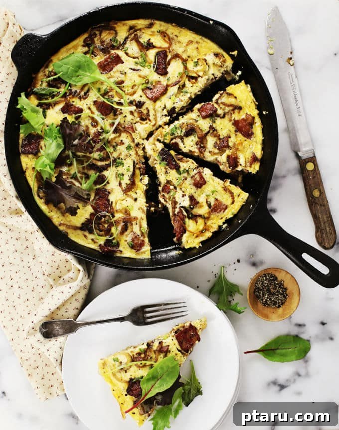Rise and Shine: 23+ Sausage and Egg Breakfast Ideas 4 A savory Potato Crusted Sausage and Cheese Quiche, freshly baked with a golden crust, ready to be sliced.