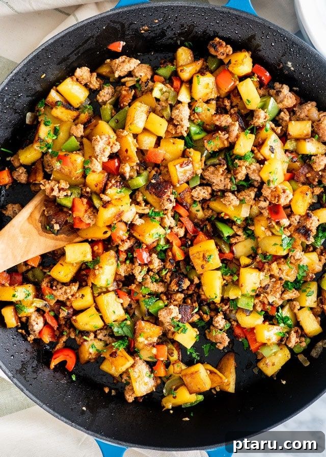 Rise and Shine: 23+ Sausage and Egg Breakfast Ideas 8 A close-up of a colorful and appetizing breakfast with sausage and eggs, showcasing fresh ingredients.