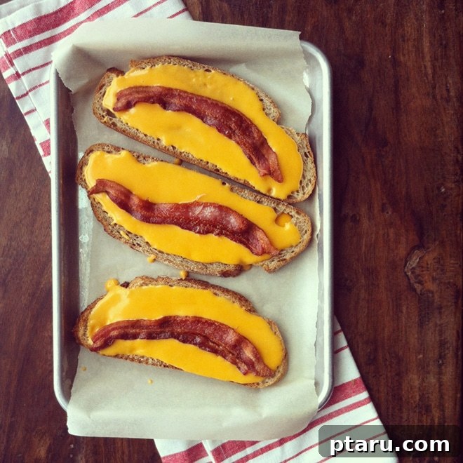 Bacon Cheese Poppers 3 Homemade cheese sauce being spread on bread slices