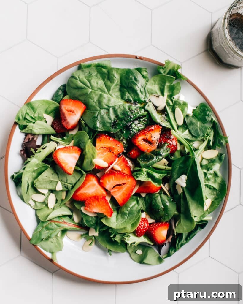 Sweet & Savory Strawberry Spinach Salad with Goat Cheese & Almonds 2 Vibrant Strawberry Spinach Salad with almonds and goat cheese, drizzled with a rich poppyseed dressing.