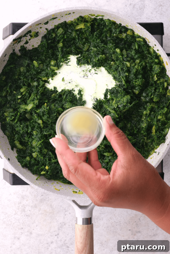 Creamy Spinach and Paneer Delight 7 Adding lemon juice to saag paneer.
