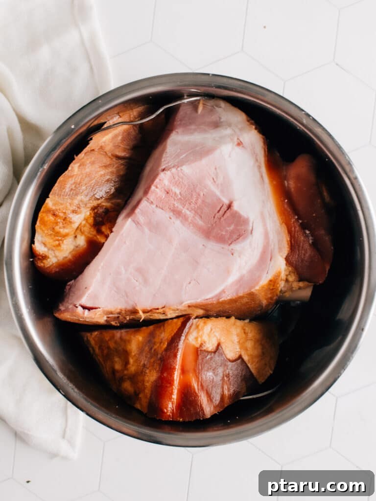 The Ultimate No-Thaw Instant Pot Chicken Recipe 10 Smoked ham inside a pressure cooker, illustrating versatility of Instant Pot.