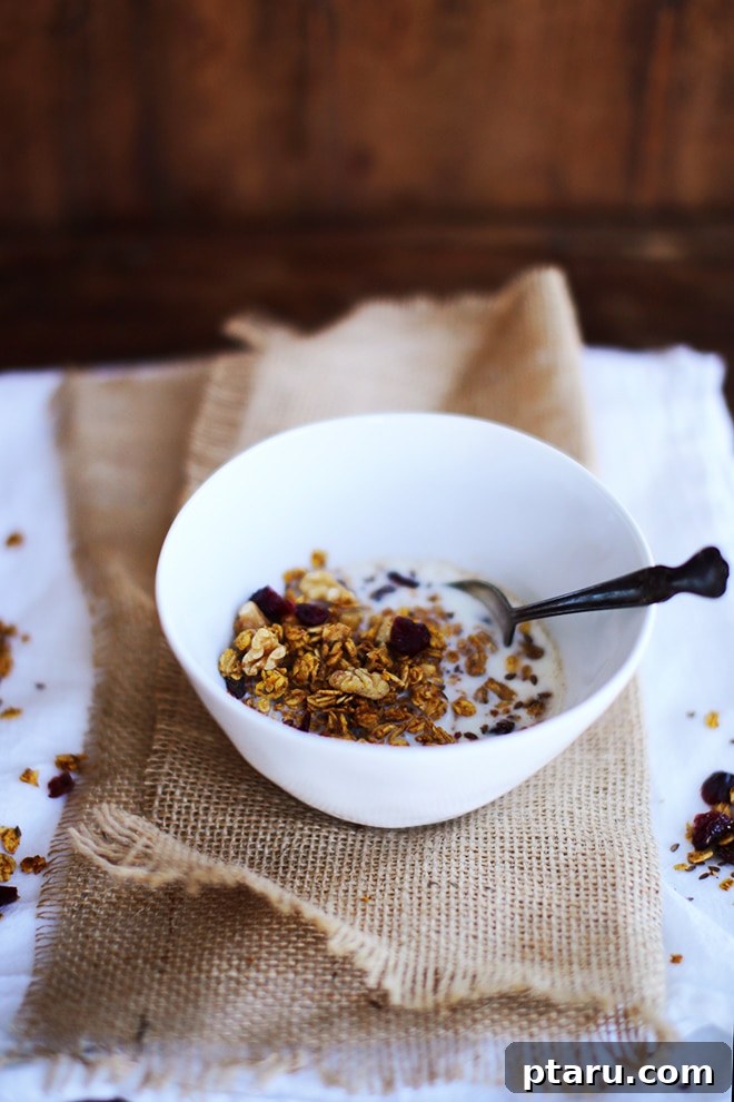 Golden Harvest Pumpkin Granola 3 A rustic overhead shot displaying all the fresh and dry ingredients meticulously laid out on a wooden surface, ready to be combined for the homemade pumpkin granola.