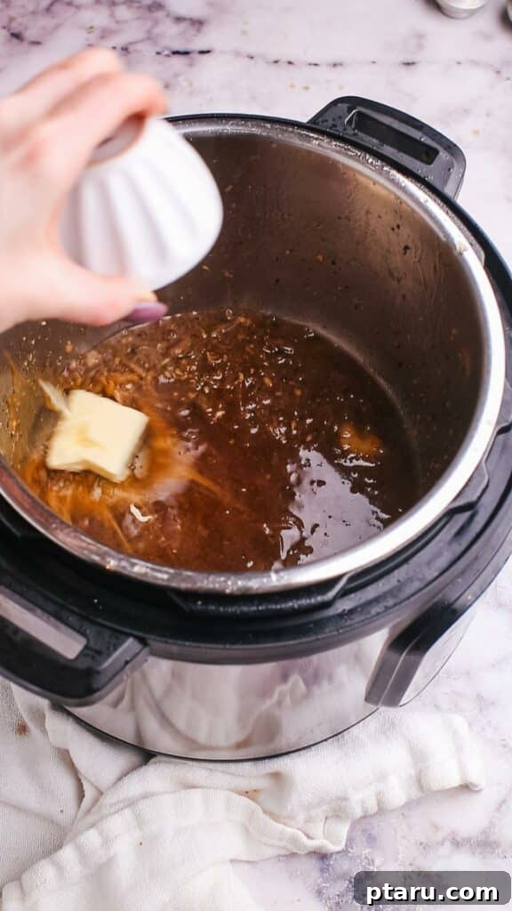 Meltingly Tender Instant Pot Steak with Rich Pan Sauce 11 Adding butter to sauce