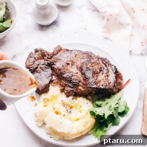 Meltingly Tender Instant Pot Steak with Rich Pan Sauce 15 Pouring gravy onto instant pot steak.