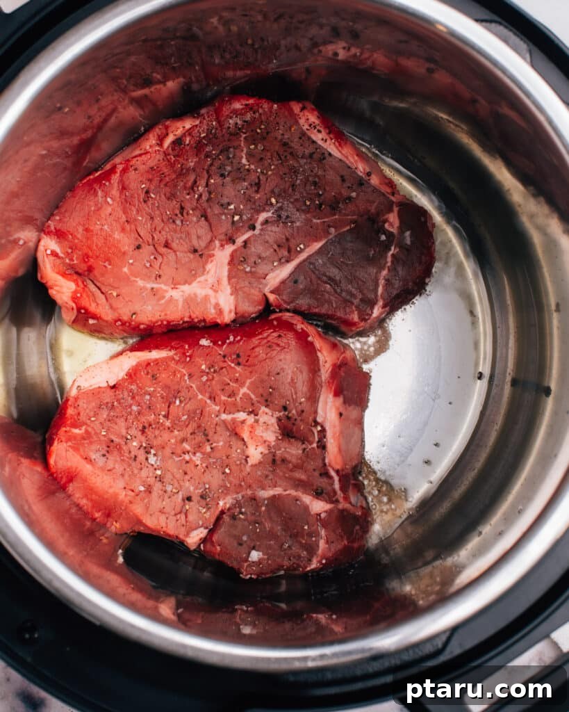 Meltingly Tender Instant Pot Steak with Rich Pan Sauce 7 Searing steak in instant pot.