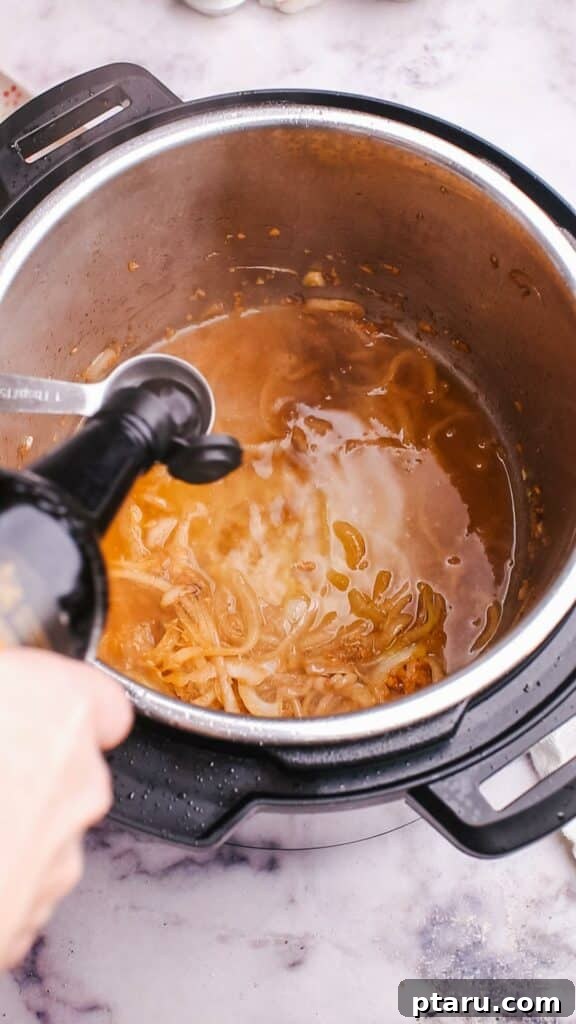 Meltingly Tender Instant Pot Steak with Rich Pan Sauce 9 adding sauce in pot