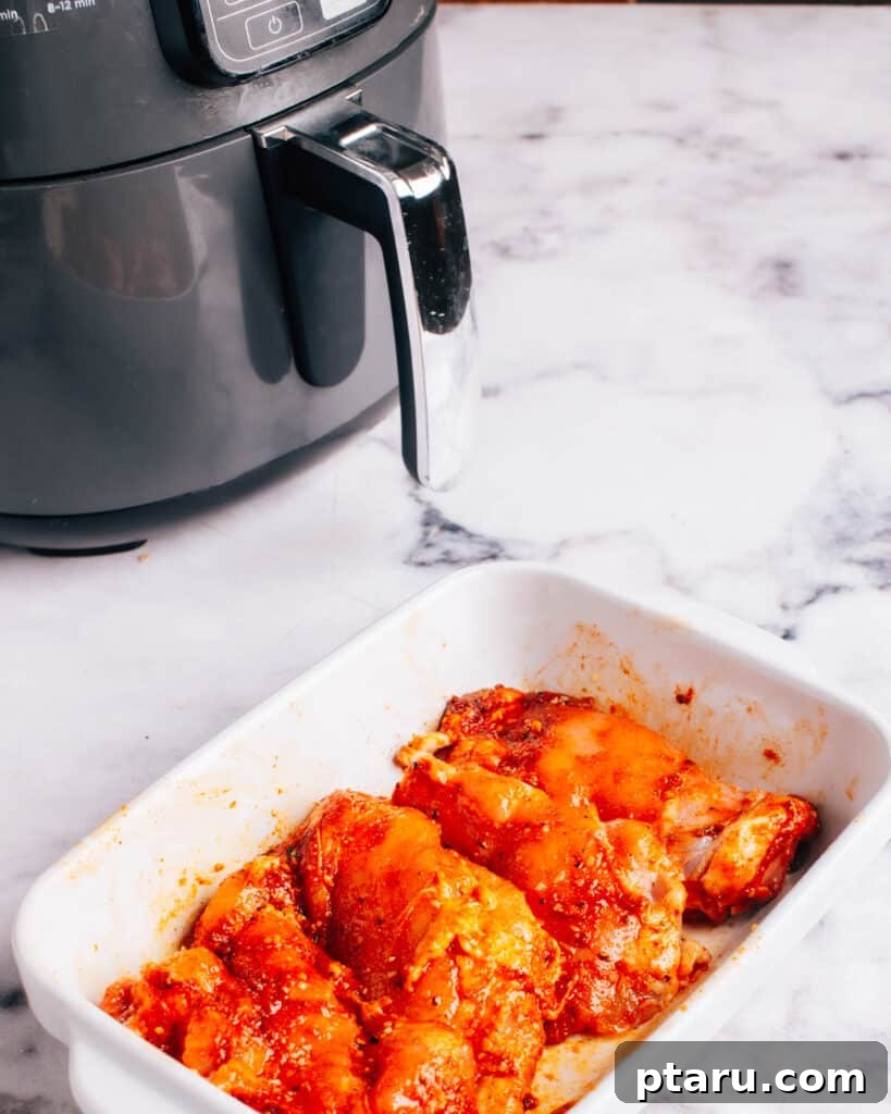 Air Fryer Boneless Thighs: Unbelievably Juicy, Incredibly Fast 5 Air Fryer Boneless Chicken Thighs after mixing ingredients and coating thoroughly.