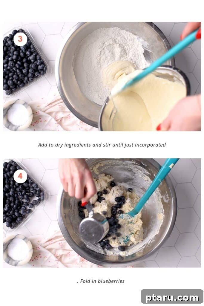 Creamy Lemon Blueberry Muffins 5 A baker carefully adding wet ingredients to dry ingredients in a large bowl, then gently folding fresh blueberries into the muffin batter with a spatula to ensure even distribution and prevent overmixing.