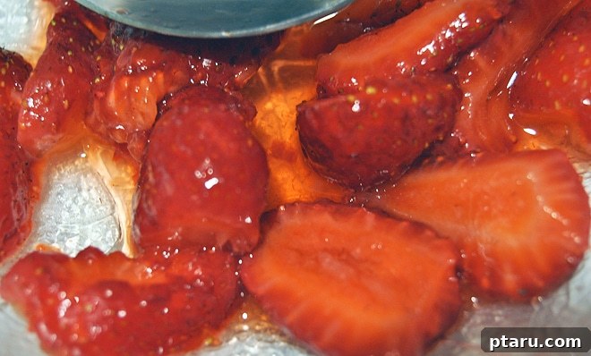 Sweet Summer Strawberry Shortcake 3 A close-up of fresh, ripe strawberries in a bowl, evoking the taste of summer and fresh produce, ready for shortcake.