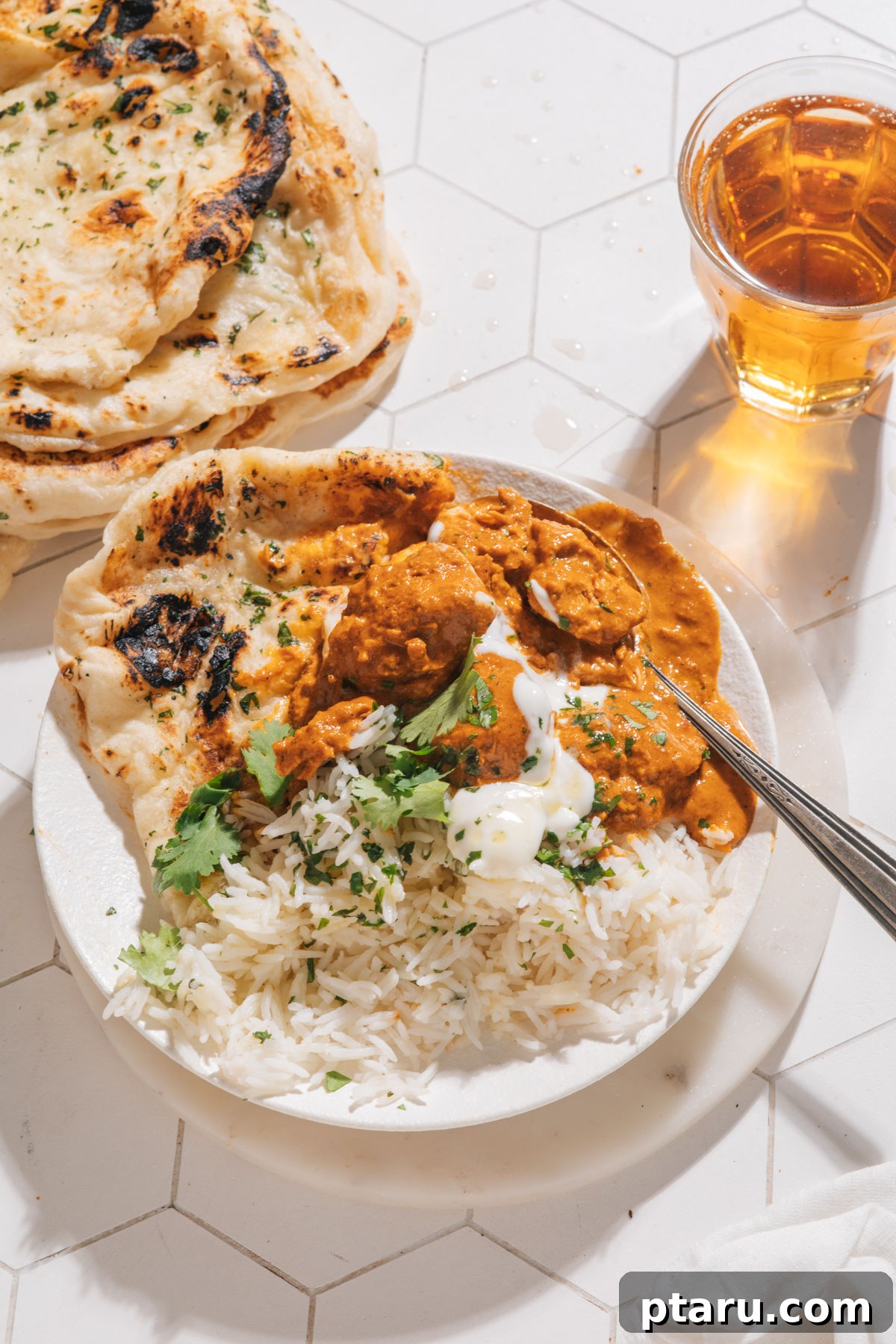 My Indian Mother-in-Laws Foolproof Basmati Rice 2 Fluffy basmati rice served alongside delicious butter chicken, showcasing its versatility and appeal.